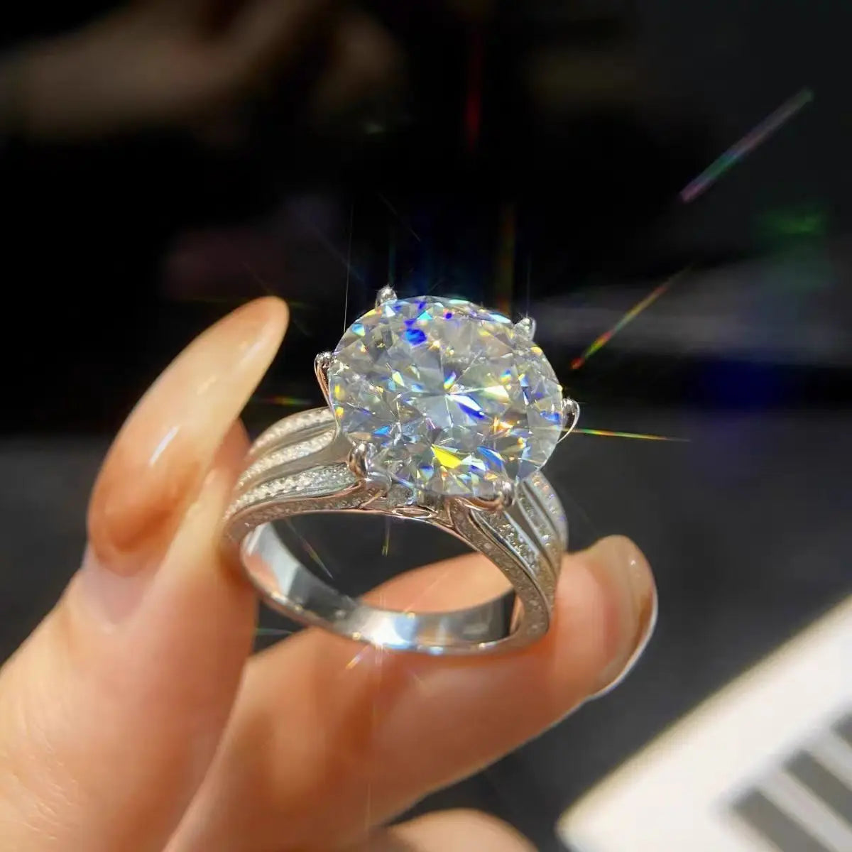 A luxurious 5-carat moissanite ring set with 18K white gold and 925 silver, perfect for a holiday gift.