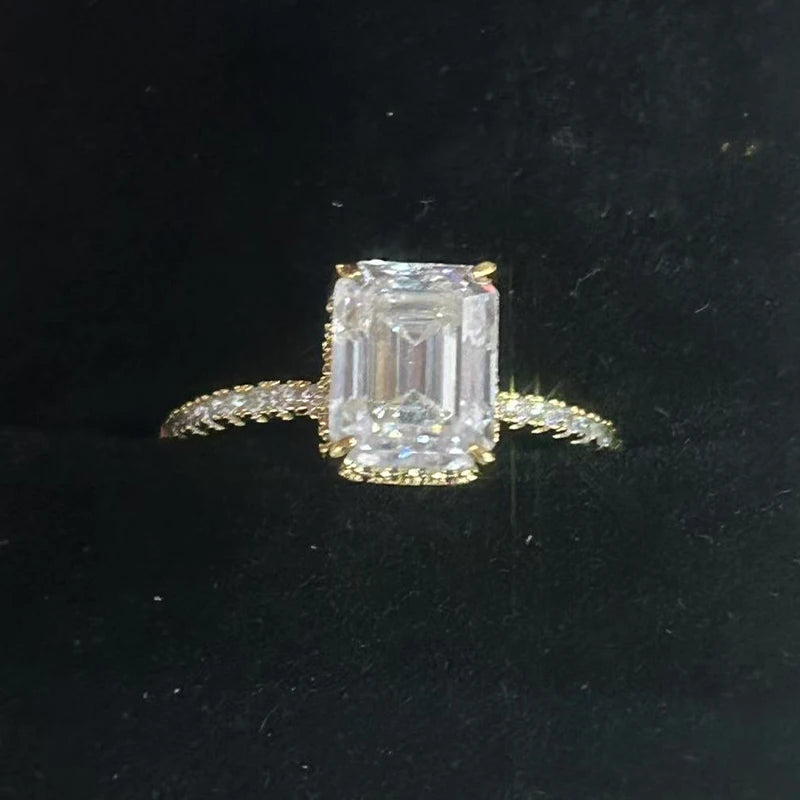 A dazzling lady's 1/2/3/4 carat moissanite engagement ring with an exquisite octagonal design, made of 925 silver plated with 18