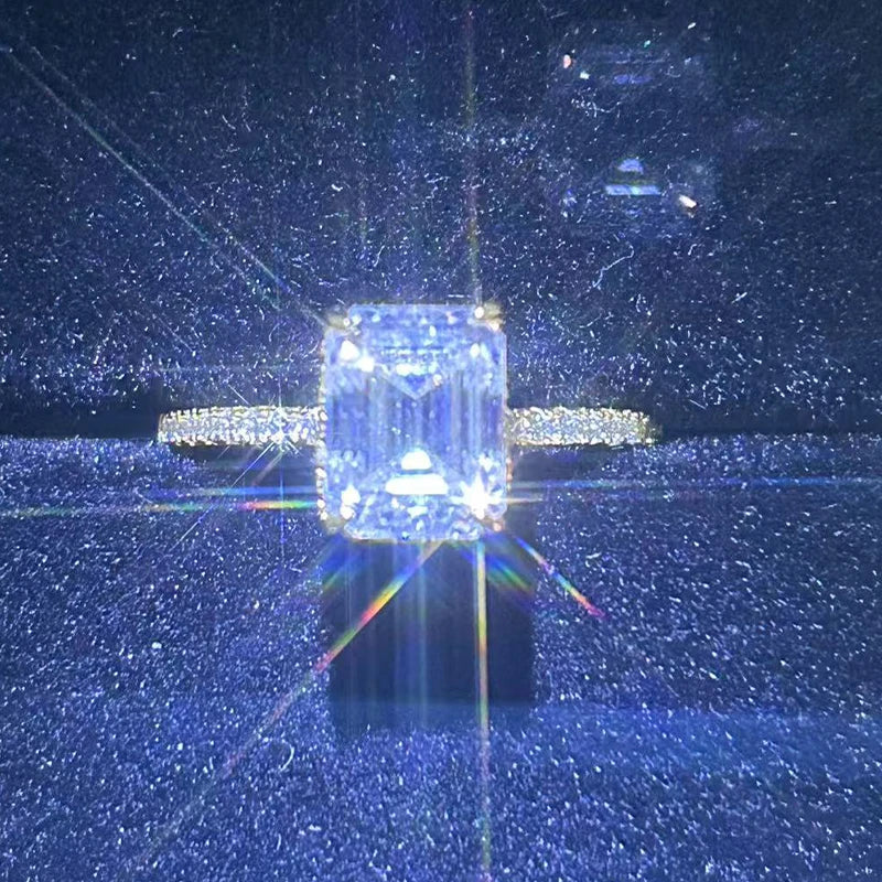 A dazzling lady's 1/2/3/4 carat moissanite engagement ring with an exquisite octagonal design, made of 925 silver plated with 18