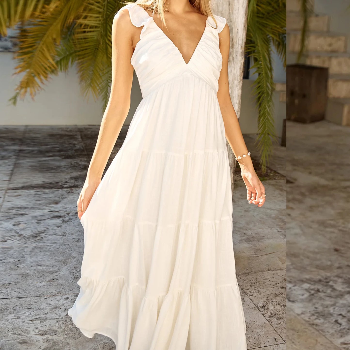 Elegant Sleeveless Maxi Dress with Boho Floral Print and Ruffled Hemline Perfect for Summer Beach Parties and Events