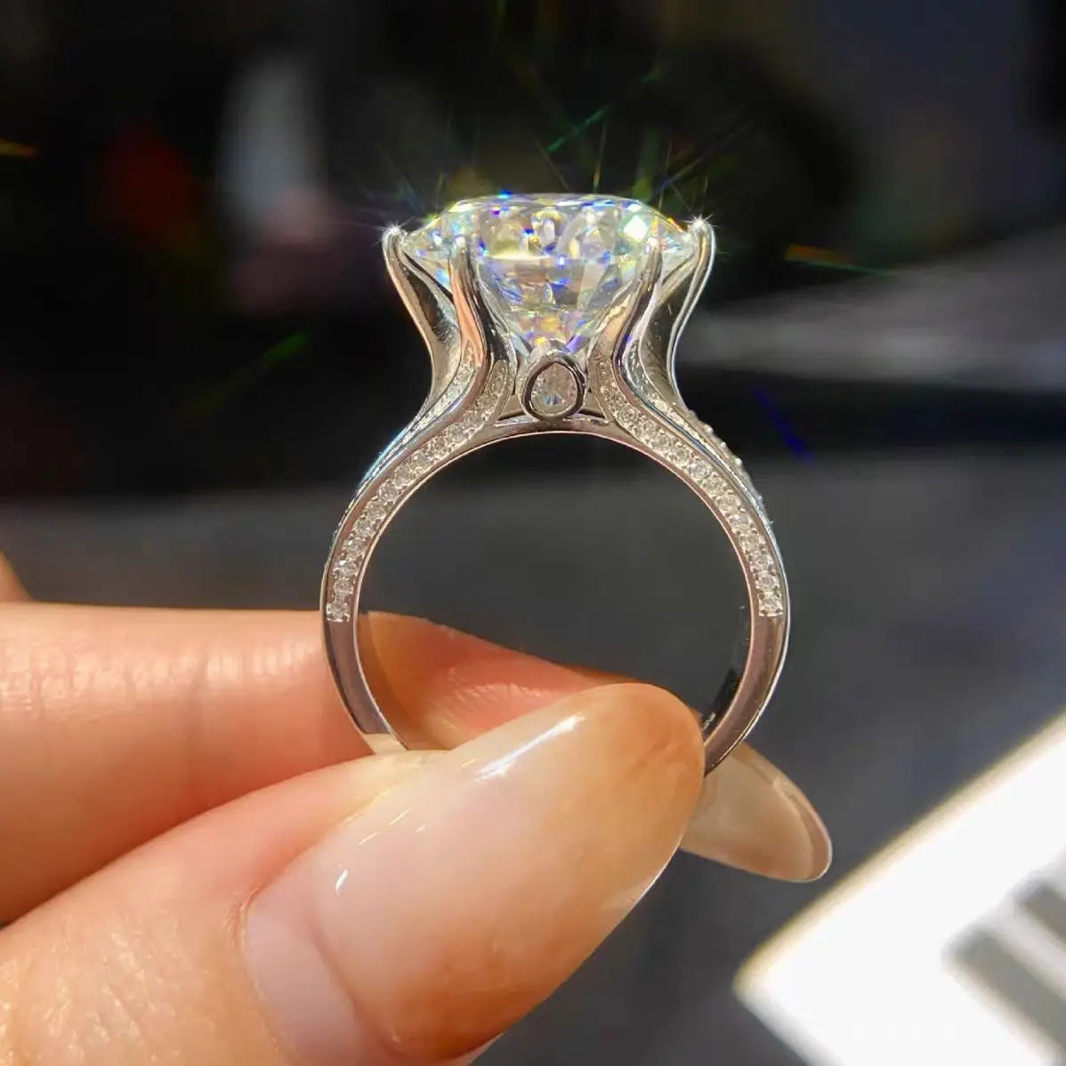 A luxurious 5-carat moissanite ring set with 18K white gold and 925 silver, perfect for a holiday gift.